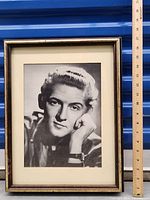 Framed portrait photo print of Jerry Lee Lewis showing size with a ruler next to it.