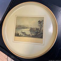 Full view of the round vintage transferware tray showing the print landscape and brass rim.