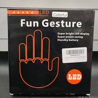 Box with packaging showing LED Fun Gesture branding, outlining the product as a colorful LED display with power saving and standby battery features.
