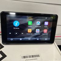 Front view of the portable media player displaying main screen with CarPlay and Android Auto icons.