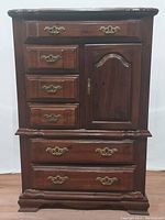 Front view of Bassett Vaughan chest of drawers showing drawer and cabinet door layout with brass hardware.