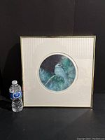 Front view of the framed "Bunting" print by David Silverberg with water bottle for size reference.