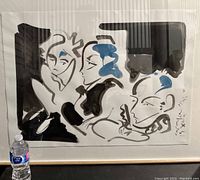 Framed artwork displaying three abstract faces in black ink and blue gouache, signed and inscribed by Brian Grimwood. Watermarked Whatman paper visible.