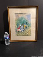 Framed watercolor painting with a water bottle for scale, showing artwork in a gold frame with matting.