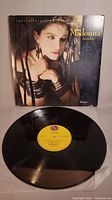 Record and original sleeve showing Madonna on the cover and the vinyl disc below showing good condition