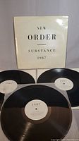 Three vinyl records from New Order titled Substance 1987 with original cover sleeve