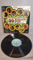 Front cover of the LP vinyl record showing colorful design and artist photos for Top Star Festival 20 Dynamic Hits compilation album.