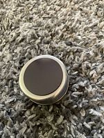 Single round magnetic seasoning container showing the strong magnet on the bottom side