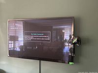 Front view of the mounted Samsung 55-inch 3D TV against wall