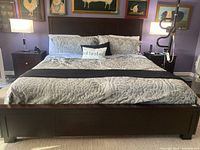 Full assembled bed frame with mattress, pillows and bedding