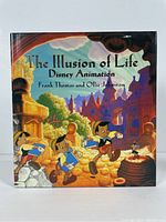 Front cover of 'The Illusion of Life: Disney Animation' book showing colored illustration of Pinocchio characters.