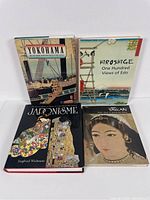 Front view of the 4 Japanese art books arranged in two rows: Yokohama, Hiroshige, Japonisme, and Taikan.