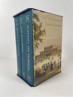 Three volumes in slipcase viewed from spine side showing titles and volume numbers