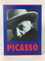 Front of blue slipcase with black-and-white photo of Picasso and red text