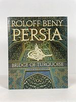 Front cover of book showing detailed Persian tile art and title in gold lettering.