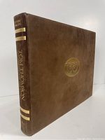 Brown reversed calf bound oblong folio book, gilt blocked spine and cover
