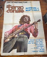 Full view of the large movie poster showing the musician playing guitar with text details.