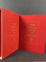 Front cover and slipcase showing red hardcover with gold embossed title 'The Rohan Book of Hours'.