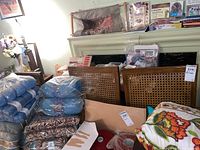 Chairs shown stacked partially behind other items, highlighting cane backed design and wood frames.