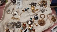 Overview of assorted jewelry pieces laid on towel