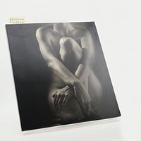 Front cover photo of softcover book with black and white nude figure photograph.