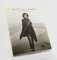 Front cover of The Last Day of Summer showing a photo of a young woman on a beach, with text indicating the book title, photography credit to Jock Sturges, and essay author.