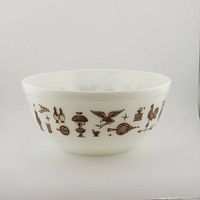Side view showing continuous brown Early American pattern on white milkglass.