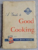 Front cover of 1954 Five Roses Flour cookbook titled 'A Guide to Good Cooking' showing wear and creases