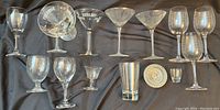 Overview of assorted glassware showing different styles including stemmed and printed glasses, cocktail glasses and small dish.