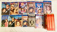 12 Shirley Temple feature film VHS tapes arranged in two rows, showing original cover artwork and titles.
