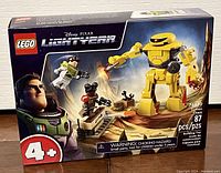 Front of the Lego Disney Pixar Lightyear set 76830 box showing the Zyclops Chase set with 87 pieces and age recommendation 4+. Factory sealed.