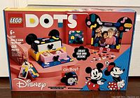 Front view of box showing set name, Disney theme with Mickey and Minnie, recommended age 6+, number of pieces 669, and example creations.