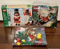 Overall view showing Lego Nutcracker box, Winter Holiday Train polybag and separate Christmas Fun VIP Add-On pack in resealable bag.