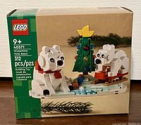 Front of factory sealed Lego set box showing the Wintertime Polar Bears set with two assembled polar bears, sled, Christmas tree, and icy base.