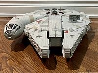 Front view of the Millennium Falcon toy showing detailed surface and cockpit area