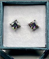 Pair of mystic topaz square stud earrings in 925 silver, displayed inside a light blue jewelry box with white cushion.