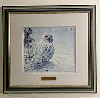 Framed art print featuring a snowy owl and milkweed with visible details of the owl and surrounding plants to show overall appearance and framing.