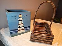 Wooden lighthouse box with handmade twig basket on table, showing size and condition.