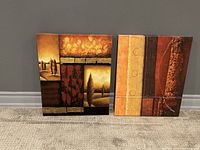 Pair of abstract canvas paintings shown side by side against a gray wall, highlighting color and texture.