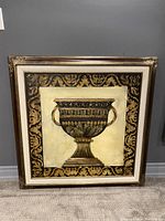 Front view of the canvas wall art showing the ornate chalice design with decorative gold and black border and detailed frame.