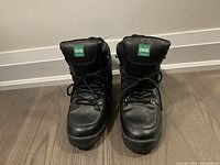 Front view of black men's Cougar boots showing padded tongues and laced fronts.