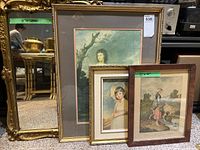 All four items together: one large gold framed mirror behind three framed artworks in various sizes.