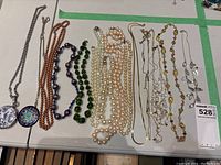 All necklaces laid out on table