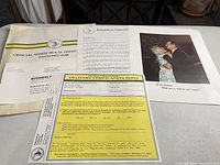 Photo of four items: official White House photo envelope, letter on Republican National Committee letterhead, delivery verification reply form, and a color photo card showing a couple dancing.
