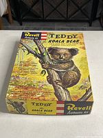 Top and side views of the vintage Revell Teddy Koala Bear model kit box showing artwork and branding.