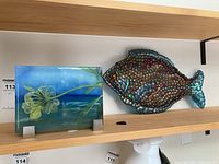 Rectangular floral glass panel and fish mosaic sculpture on shelf