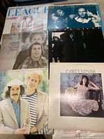 Five LP album covers including Simon & Garfunkel, Carly Simon and others