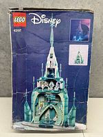 Front view of damaged Lego Disney Frozen Castle box showing set number 43197 and images of the castle