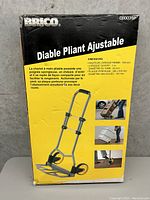 Box of Brico brand adjustable foldable hand trolley showing product image, features and dimensions in French.