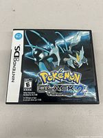 Front of the Nintendo DS game case showing Pokémon Black Version 2 cover art with Black Kyurem.